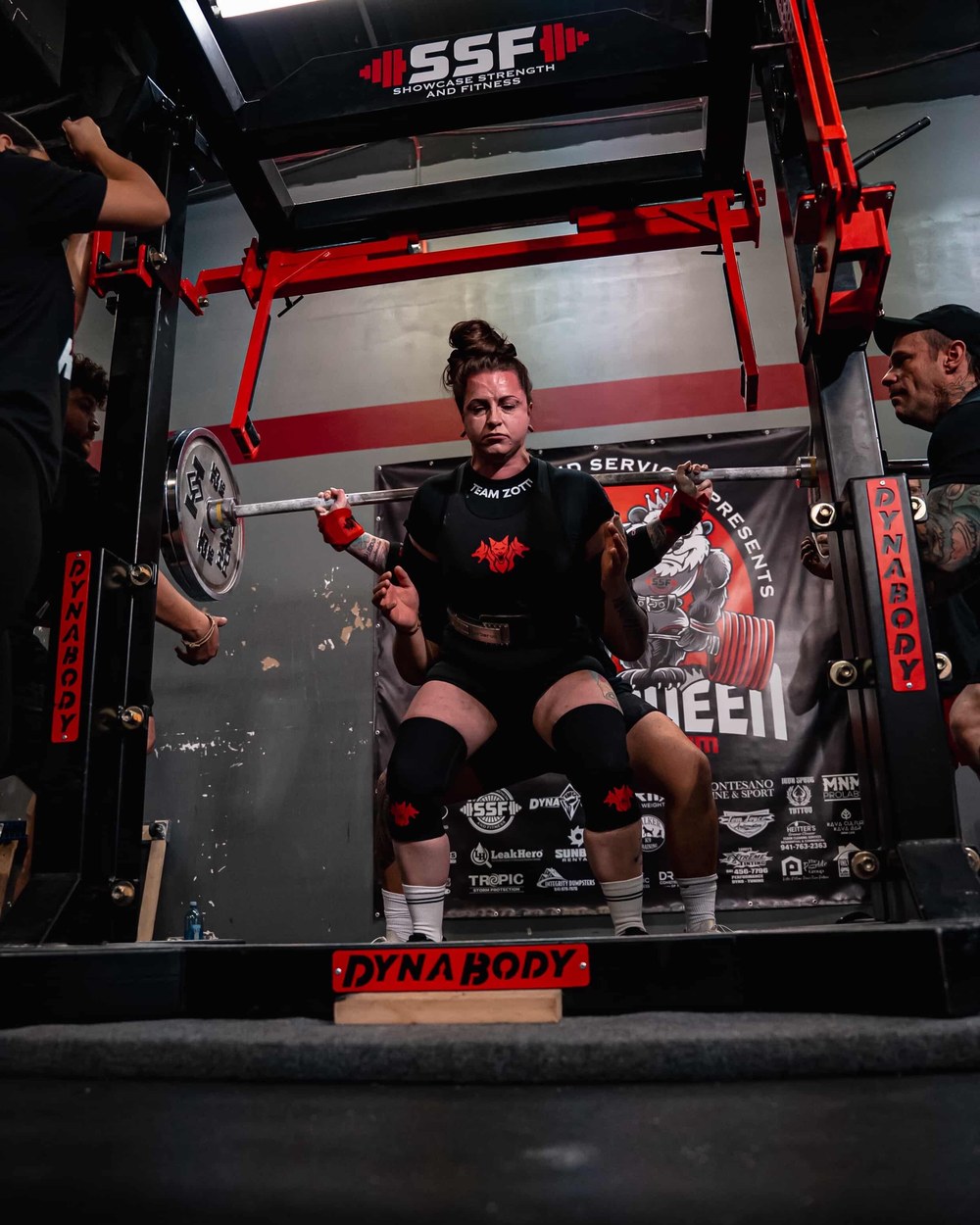Helene Zottl squatting at a powerlifting competition